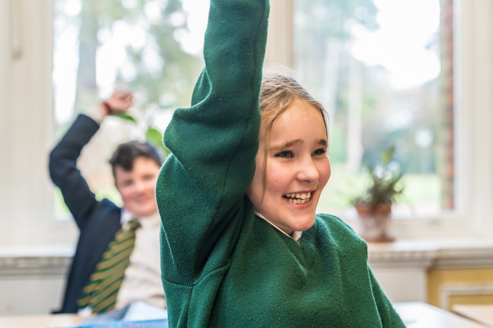 Sackville pupil with hand raised in class